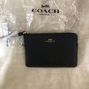 Coach black leather wristlet. Brand new with tags.